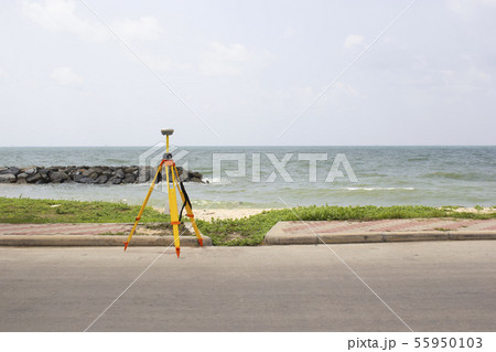 GPS surveying in field sea background, Global 55950103