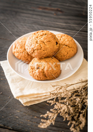 oatmeal raisin cookies on wood 55950224