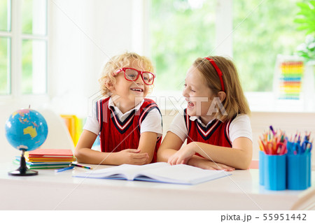 Kids doing homework. Children go back to school. Kids doing homework. Children go back to school. 55951442
