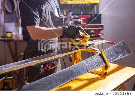 Repair, people concept - mechanic, man is rubbing a ski 55953368