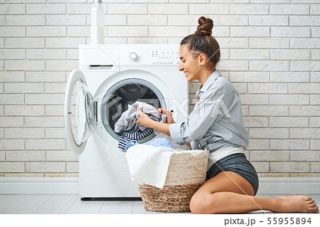 woman is doing laundry woman is doing laundry 55955894