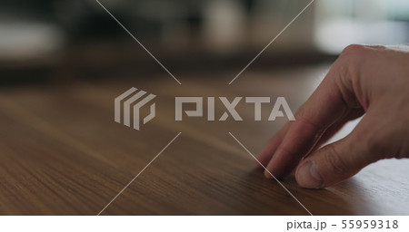 woodworker checking oil finish on black walnut woodworker checking oil finish on black walnut 55959318