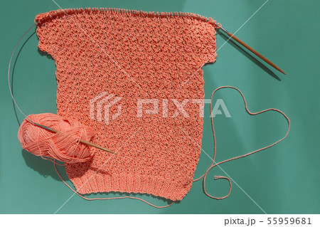 coral sweater made of cotton with heart shape made of thread, knitted with an openwork pattern on coral sweater made of cotton with heart shape made of thread, knitted with an openwork pattern on 55959681