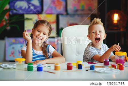 funny children girl  and boy draws laughing   with 55961733
