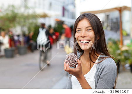 Woman eating traditional danish food floedeboller Woman eating traditional danish food floedeboller 55962107