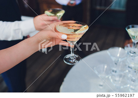 Pyramid of wine glasses with champagne . Champagne is poured into the glasses. Festive decoration of Pyramid of wine glasses with champagne . Champagne is poured into the glasses. Festive decoration of 55962197