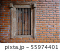 Old brick wall with brick window. 55974401