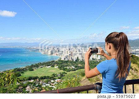 Hawaii tourist taking photo Honolulu Waikiki beach Hawaii tourist taking photo Honolulu Waikiki beach 55975027