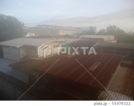 white morning fog over the roofs of village houses 55976322
