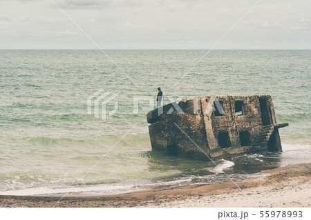 Man stands on the part of the destroyed fort Man stands on the part of the destroyed fort 55978993