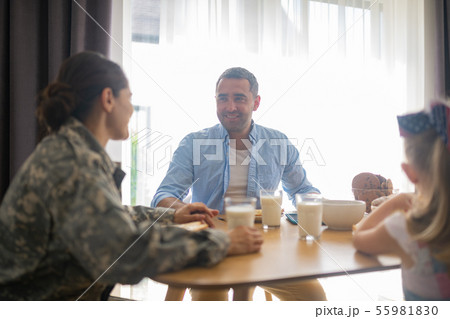 Military woman feeling happy looking at husband and daughter 55981830