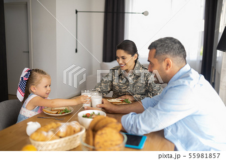 Happy beaming family having breakfast all together Happy beaming family having breakfast all together 55981857