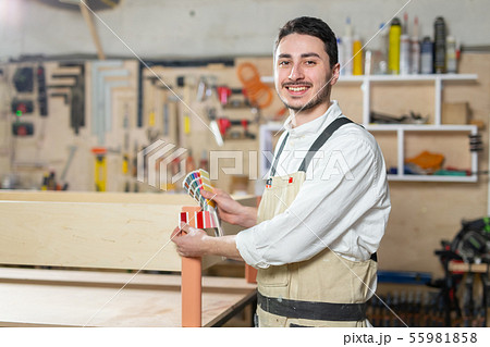 Small-Sized Companies, furniture and worker concept - Handsome young man working in the furniture 55981858