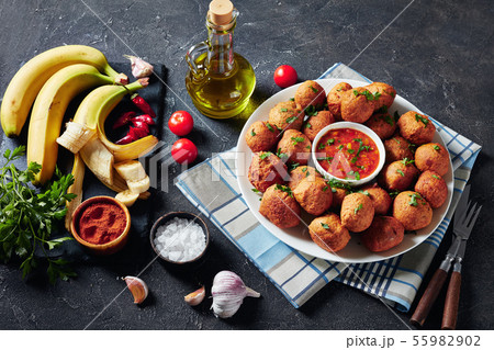 spicy Plantain fritters Klako on a white plate spicy Plantain fritters Klako on a white plate 55982902