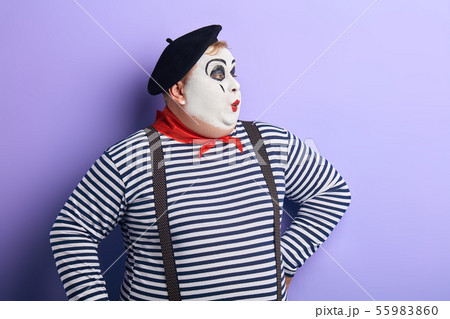 Pantomime actor performing on the stage 55983860