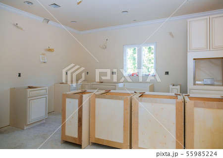 Custom kitchen cabinets in various stages of 55985224