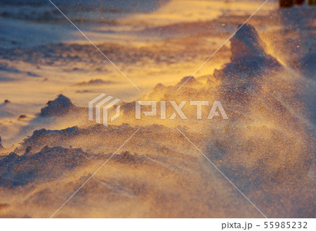 Sun rays on snowy mountains. Cold weather. 55985232