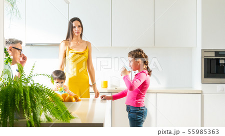 The young family with two children are drinking The young family with two children are drinking 55985363