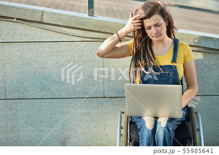 attractive young woman in fashion clothes attends vebinars.activity limitation. 55985641