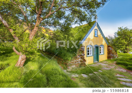 Picturesque view of  turf-top church Hofskirkja 55986818
