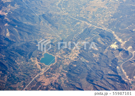 View from airplane, city in a mountain and coast 55987101