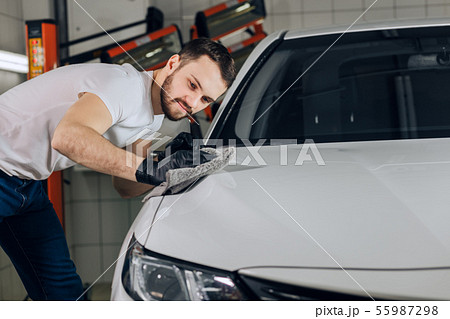 awesome man takes care of his car 55987298