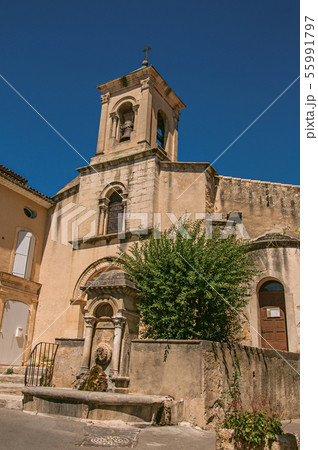 House with flowers and church in Lourmarin House with flowers and church in Lourmarin 55991797