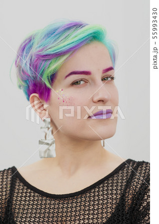 Young beautiful woman with dyed blue and green hair. Pixie bob short haircut The concept of hair 55993430