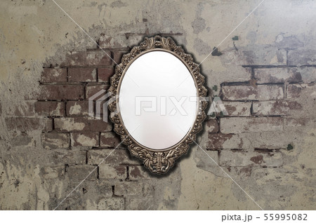 Vintage antique mirror on old brick wall background texture 55995082