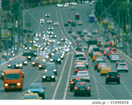 Blurred motion on city highway in rain day 55996858