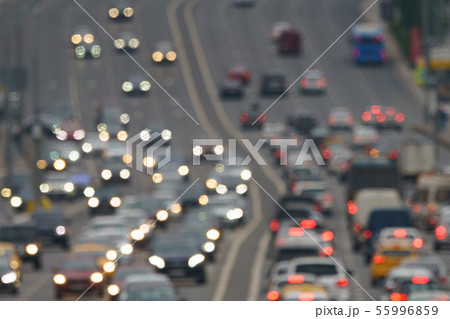 Blurred motion on city highway in rain day 55996859