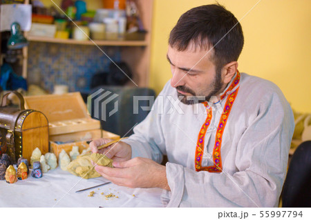 Potter making clay figure for board game Potter making clay figure for board game 55997794