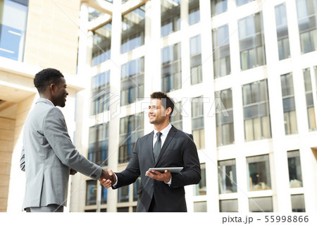 Business handshake in the city Business handshake in the city 55998866