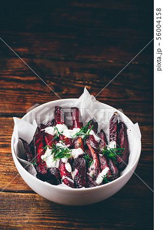 Oven baked beet fries with sour cream and dill Oven baked beet fries with sour cream and dill 56004158