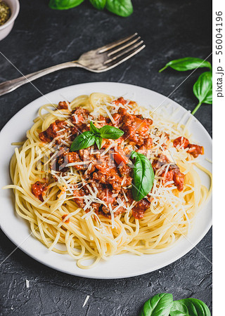 Spaghetti with bolognese sauce, parmesan and basil Spaghetti with bolognese sauce, parmesan and basil 56004196