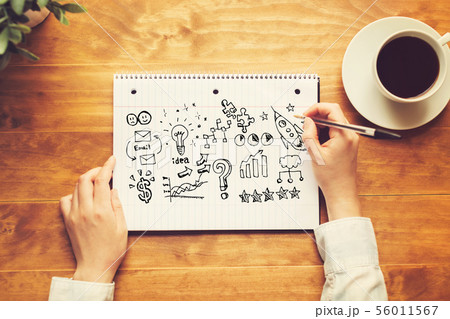 Business strategy ideas with a person holding a pen 56011567