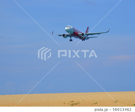 Airplane landing at Phuket Airport Airplane landing at Phuket Airport 56013462