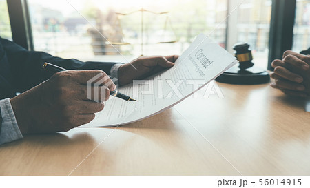 Judge gavel with Justice lawyers having team 56014915