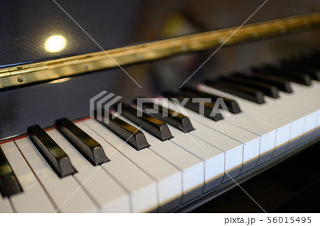 Piano keyboard instrument with shining background. 56015495