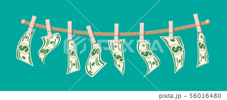 Wet dollar bills hanging on rope 56016480