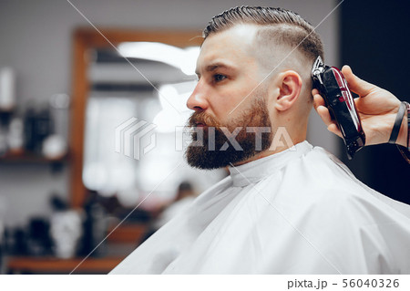 Stylish man sitting in a barbershop 56040326