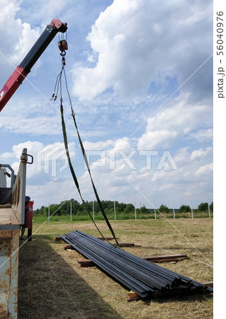 The master and his assistant send a metal profile, 56040976