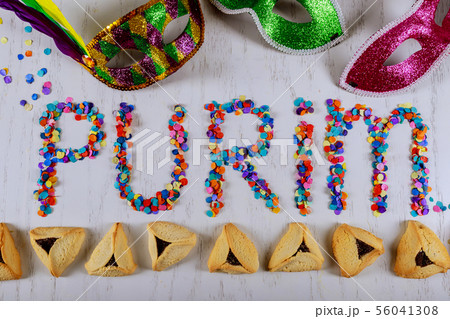 Hamantaschen cookies and carnival mask purim 56041308
