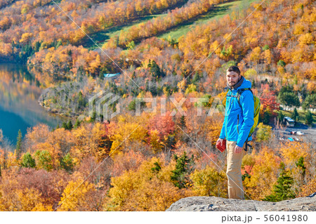 Backpacker man at Artist's Bluff in autumn Backpacker man at Artist's Bluff in autumn 56041980
