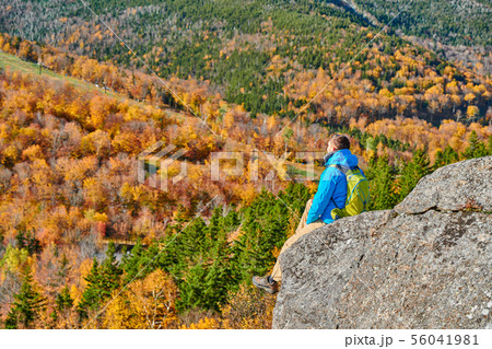 Backpacker man at Artist's Bluff in autumn 56041981