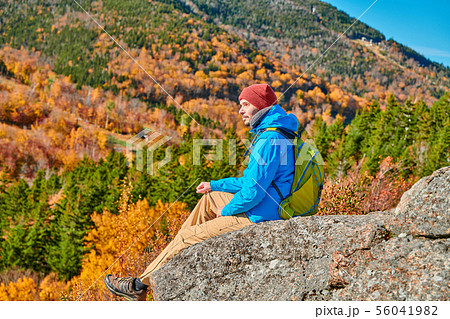 Backpacker man at Artist's Bluff in autumn Backpacker man at Artist's Bluff in autumn 56041982