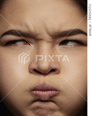 Close up portrait of young emotional woman 56042551