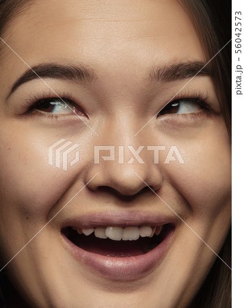 Close up portrait of young emotional woman 56042573