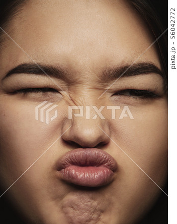 Close up portrait of young emotional woman Close up portrait of young emotional woman 56042772