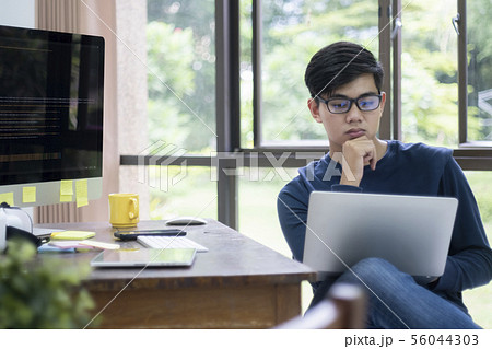 Programmers and developer teams are coding and 56044303